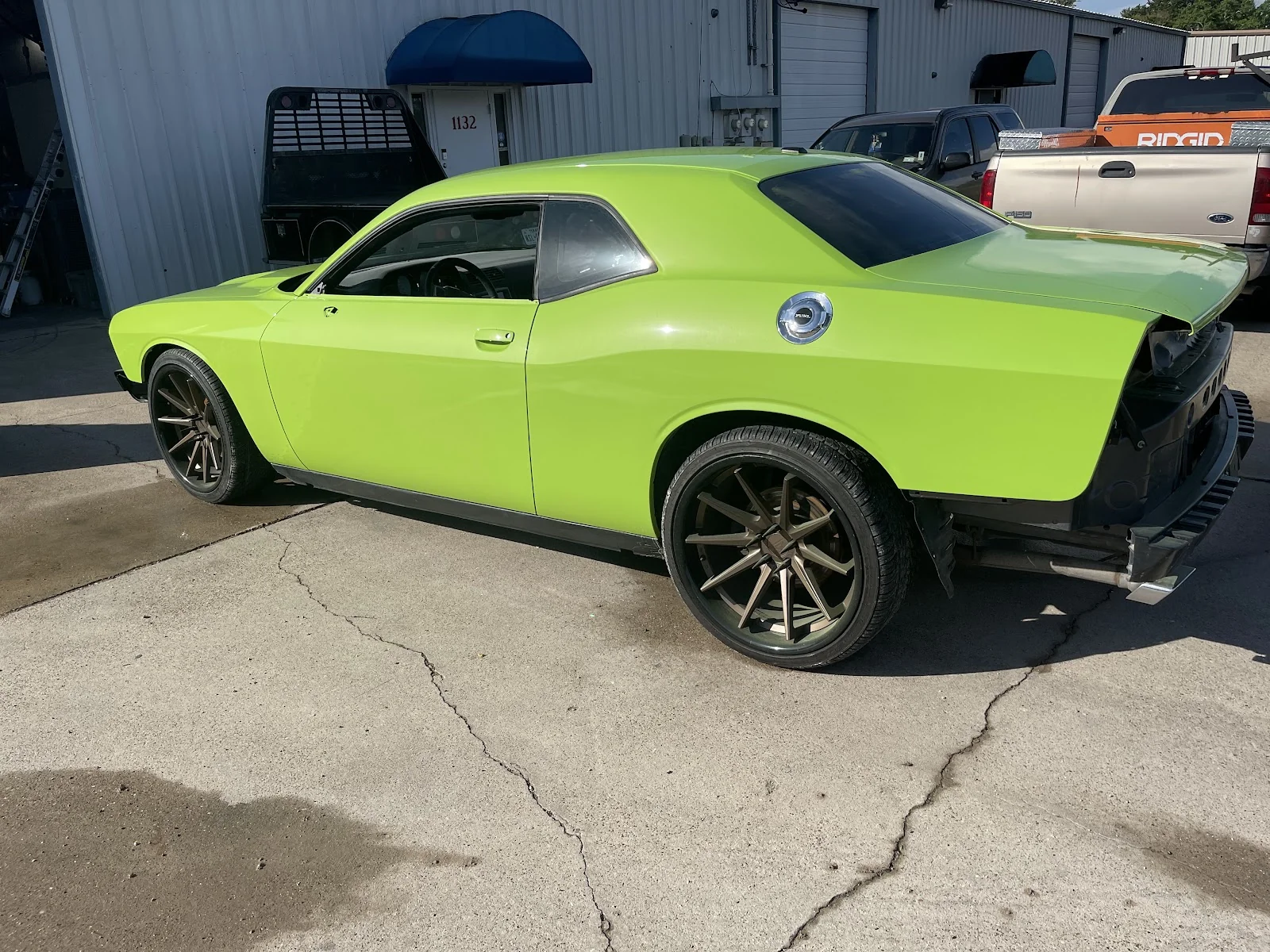 Custom green Dodge Challenger paint job at Correct It Collision Alvin TX